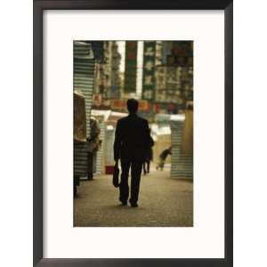  Office Worker with a Briefcase Walks down a Kowloon Street 