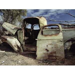  An Old Wrecked Truck in a Desert Environment Photographic 