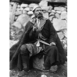  1890s photo Old peasant with dagger and long smoking pipe 