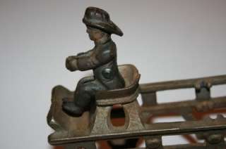 Up for sale is an Genuine old cast iron ladder fire wagon. I do not 