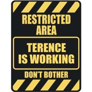   RESTRICTED AREA TERENCE IS WORKING  PARKING SIGN