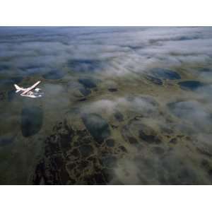 Seaplane over Clouds and the Tundra of Alaskas North Slope, North 