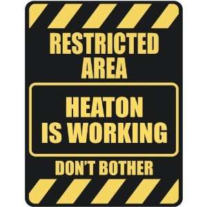   RESTRICTED AREA HEATON IS WORKING  PARKING SIGN