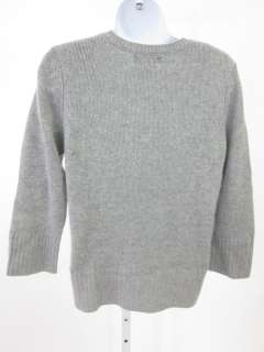   long sleeves, a v neck line, and is solid gray. A great addition to