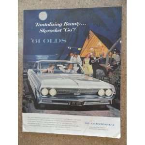 1961 Oldsmobile, Vintage 60s full page print ad. (blue car/man,woman 