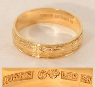 An engraved mans wedding ring made in 18 carat gold 