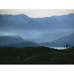  Mist Settles in Lake Valley with Snow Capped Mountains in 